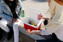 Red 9 qt small cooler with white lid open, holding cans and bottles