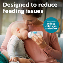 Anti-colic baby bottle held for feeding, clear bottle with white nipple