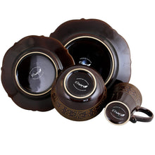 Stoneware bowls and cups with dark brown glaze and gold-toned rim accents