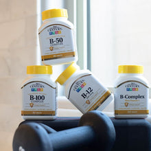 B-50 Complex supplement bottle shown with other yellow-capped supplement bottles