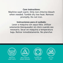 White bed pillow with care-instructions icons and washing directions on label