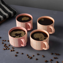 4 pink stoneware stacking mugs with white chevron lines and handles