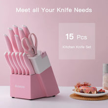 Pink kitchen knife set with multiple stainless knives in a countertop block