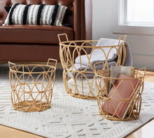 Woven poly rattan storage basket with handles holding folded towels