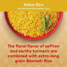 Saffron yellow basmati rice in a red-rimmed bowl with a green chili garnish