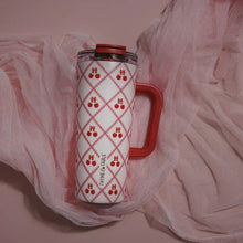 Stainless steel tumbler with red handle and clear lid, lace cherry lattice pattern