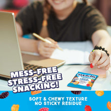 Welch's Mixed Fruit Fruit Snacks pouch held during snack time at a table