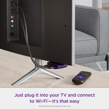 Roku LE streaming media player on a TV stand with connected power and remote