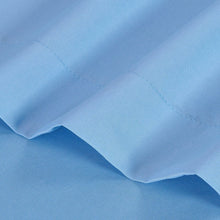 Light blue flat bed sheet with stitched seam and folded corner detail