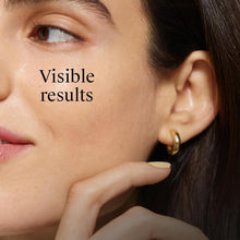 Woman’s cheek and ear with moisturizer sheen; visible results text nearby