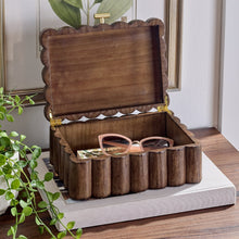 Wooden jewelry box with open lid and scalloped base compartments, natural brown.