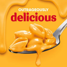 Velveeta shells and cheese sauce drip held on a spoon
