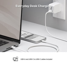 White USB-A to USB-C charging cable connecting laptop and power adapter