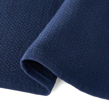 Kitchen towel detail: dark navy solid waffle-texture fabric corner