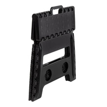 Black plastic folding step stool with fold-out design and side grip cutouts