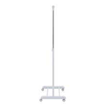 White rolling garment rack standing with vertical posts and four caster wheels