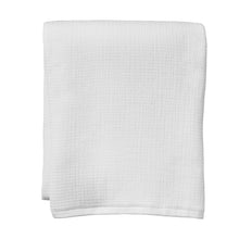 Arctic white bath towel set, neatly folded with subtle textured surface