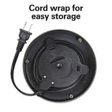 Electric kettle base underside with cord wrap for storage and power plug