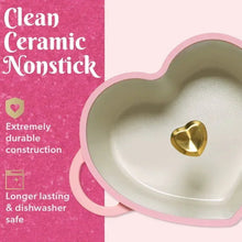 Cream heart-shaped Dutch oven interior with gold heart knob