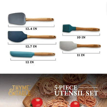 Five silicone kitchen tools with beechwood handles in blue, gray, and teal colorways