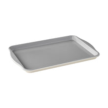 Gray nonstick baking tray with raised rim and short side handles