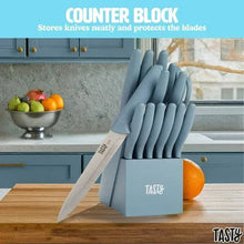 Slate blue stainless steel knife set in counter block with one knife angled outward