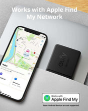 Black eufy Security smart tracker card beside smartphone