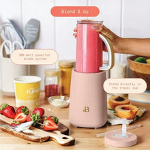 Rose personal blender with clear blend cup on base and travel lid for blending on-the-go