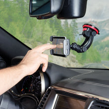 Black dashboard phone mount with clamp arms and spring suction base, red accents
