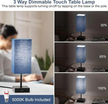 Blue fabric table lamp with black base and included LED bulb