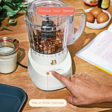 White 3-cup food chopper with clear bowl and speed dial, hand adjusting settings