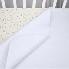 White fleece multi-use pad with diagonal quilting and folded edge