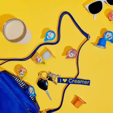 I ❤️ creamer graphic showing creamer packets and a map-like line