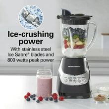 Black blender with glass jar showing ice-crushing blade and berries