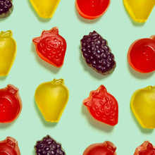 Mixed fruit flavored snack gummies in strawberry, grape, and citrus shapes