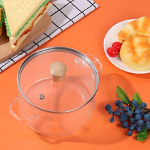Glass cooking pot with lid, clear ribbed bowl and two side handles, cork knob