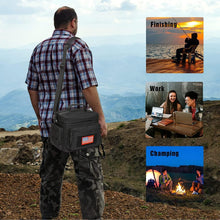 Black insulated lunch cooler bag worn crossbody/back with zip front pouch and shoulder strap.