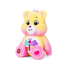 Plush heart bear with rainbow-heart belly design, seated pose