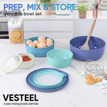 Set of mixing bowls with lids in blue, teal, and white colors for prep and storage