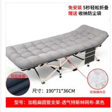 Gray padded folding camping cot with quilted mattress and steel support frame