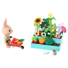 Garden playset with bunny and wheelbarrow plus raised planter, watering can, and flowers