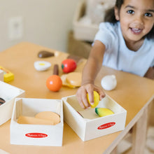 Wooden food groups crates with colorful pieces for toddler play