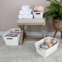 White plastic storage bin with side carry handles for organizing small items