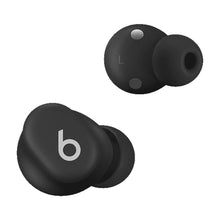 Dark wireless earbuds with L/R markings and silicone tips, earbud cradle fit