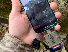 Smartphone with attached SD card reader accessory, tan body and black strap