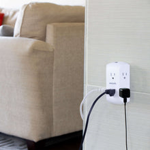 White wall outlet tap mounted on wall with two connected adapters