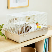 Split-level hamster habitat with running wheel, two platforms, and light beige base