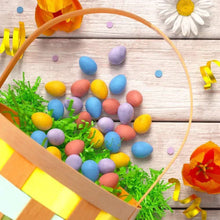 Mini eggs candy scattered in a colorful Easter basket with grass and decorations