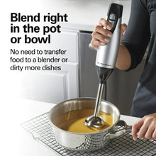 Immersion hand blender with blending wand in mixing pot