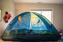 Blue kids dome bed tent with moon and star decals set up in a bedroom